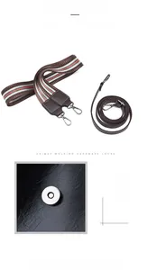 Détail des deux bandoulières et du fermoir magnétique sur le sac seau en cuir noir