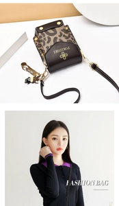 Leopard print crossbody phone bag with gold clasp and cute bear charm shown on model