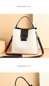 Détail du sac seau rétro avec surpiqûres contrastées et boucle carrée noire élégante
