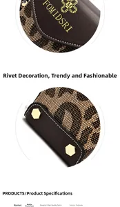 Close-up of leopard print phone bag featuring golden logo and hexagonal rivet details