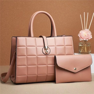 Solid color embossed two-piece tote bag set with matching clutch in dusty pink PU leather