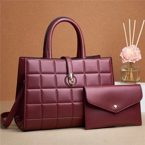 Burgundy quilted two-piece handbag set with gold clasp and top handle for women