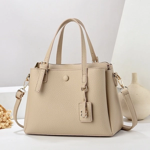 Elegant off-white lychee texture tote bag with gold hardware and removable shoulder strap