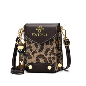 Mini leopard print crossbody phone bag in brown leather with a cute bull charm