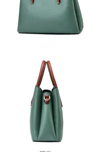Macro side and back views of large green leather tote bag with gold metal hardware