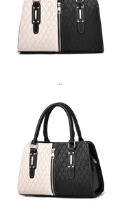 Detail of color-block tote bag with geometric circular patterns and metal zipper