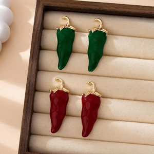 Quirky red and green chili pepper enamel earrings in a vintage style velvet box