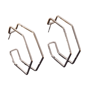 Modern geometric hexagonal double-line silver stud earrings with minimalist aesthetic