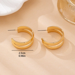 Elegant 2.5cm gold-tone double C-hoop earrings with a polished finish and stud closure
