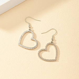 Fashionable silver hollow heart earrings with elegant beaded texture and hook design