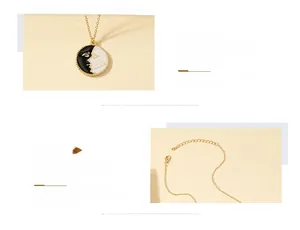 Detail of gold coin necklace featuring black and white enamel face pendant and lobster clasp