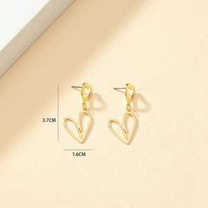 Detailed view of hollow heart drop earrings in gold finish with size measurements