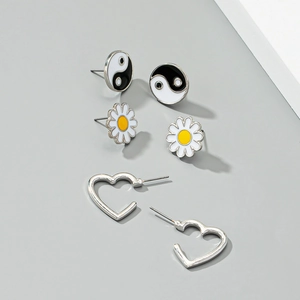Enamel daisy earrings set with yin yang symbols and silver heart studs for women