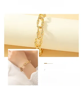 Detailed view of vintage gold alloy chain bracelet with bold U-link buckle and adjustable clasp