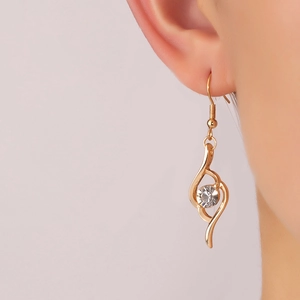 Elegant gold S-shaped drop earrings for women with a sparkling clear cubic zirconia stone