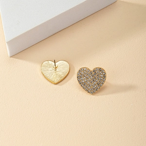 Fashionable heart-shaped gold-tone stud earrings with pavé rhinestones in front and back view