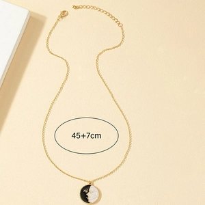 Golden chain necklace with black and white enamel face coin pendant, length 45+7cm