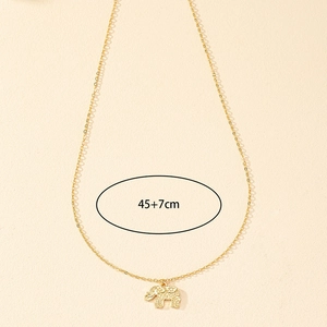 Detail of golden elephant pendant showing 45+7cm adjustable chain length on texture