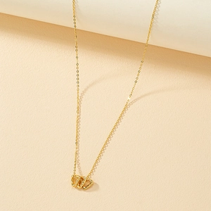 Minimalist gold necklace featuring three interlocking irregular heart-shaped pendants