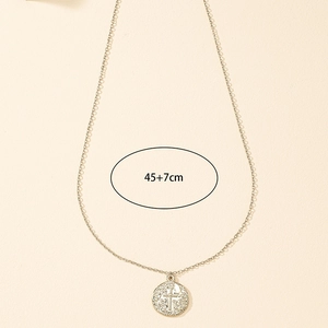 Detailed close-up of a silver cross coin pendant with 45cm plus 7cm extender chain length