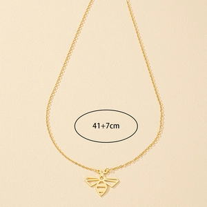 Detailed view of golden bee pendant necklace showing adjustable 41cm plus 7cm chain length