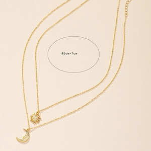 Golden double layer necklace featuring sun and moon pendants with 45cm plus 7cm chain length
