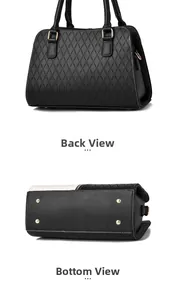 Detail view of the black textured leather tote with back panel and protective bottom studs