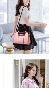 Pink and brown contrast leather shoulder bag with gold logo and metal chain strap