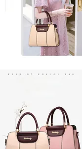 Detail of stylish two-tone tote bags in beige and pink with premium golden hardware logo