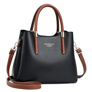 Black crocodile pattern tote bag with brown handles and Fashion Queen gold hardware