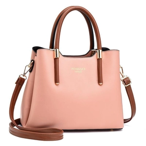 Pink faux leather tote bag with brown handles and Fashion Queen text on white background
