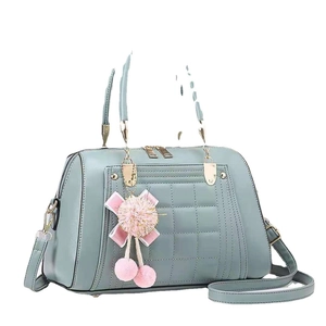 Morandi green quilted tote bag with checkered pattern and plush charm on white background