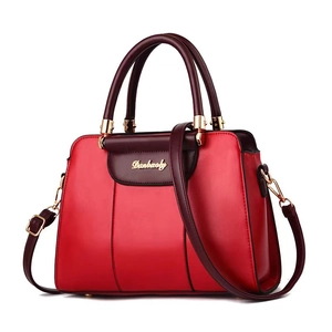 Minimalist red and purple contrast shoulder bag with golden hardware and long strap