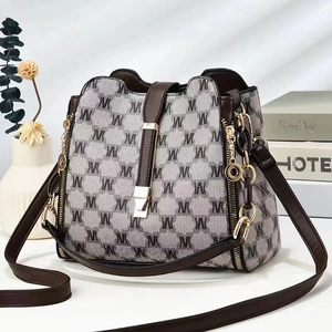 Women's chic contrast monogram canvas bucket bag with premium leather trim and chain charm