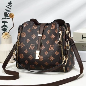 Vintage monogram bucket bag in brown leather with gold hardware and side zipper detail