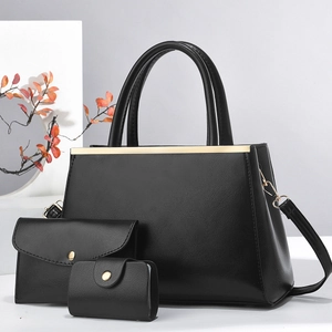 Close-up of black 3-in-1 shoulder bag set with large tote, envelope clutch and card holder