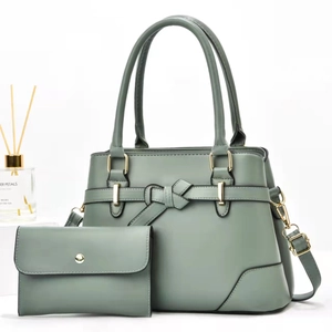 Sage green elegant tote bag and wallet set with decorative leather knot and gold hardware