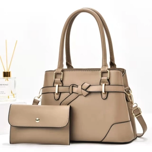 Elegant khaki tote bag and matching clutch set with decorative bow and gold hardware