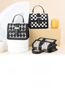 Three elegant houndstooth and clover patterned shoulder bags with metal buckles on pedestals