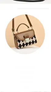 Detail of retro argyle pattern brown crossbody bag with gold metal square lock