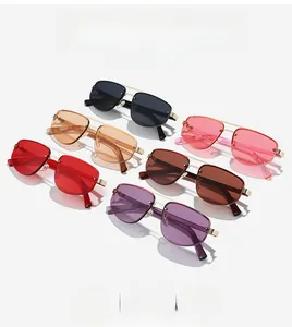 Macro detail of multi-colored aviator sunglasses with gold double bridge frames