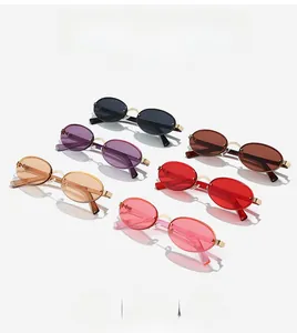 Detail view of retro oval rimless sunglasses in six assorted lens colors with gold metal frames