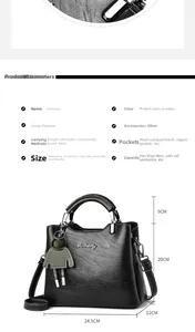 Detail view of black oily wax leather tote with adjustable strap and interior capacity
