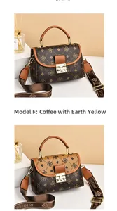 Detail view of vintage patterned crossbody bags with metal clasps and broad straps