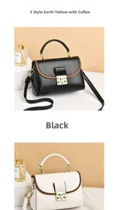 Detail of minimalist flap handbag with gold metal clasp and contrast trim handles