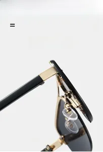 Detailed close-up of premium golden metal hinges and black lightweight temples on sunglasses