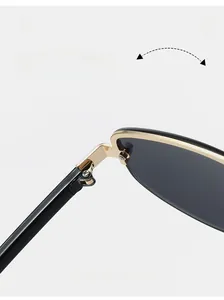 Macro detail of durable gold metal hinges on stylish semi-rimless sunglasses
