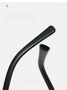Macro detail of ergonomic black glossy curved mirror legs for comfortable temple wear