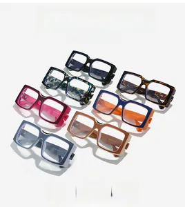 Macro view of seven stylish oversized square glasses in assorted colors and patterns