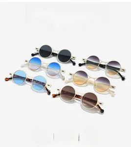Macro shot of assorted vintage oval sunglasses with various colorful gradient lenses